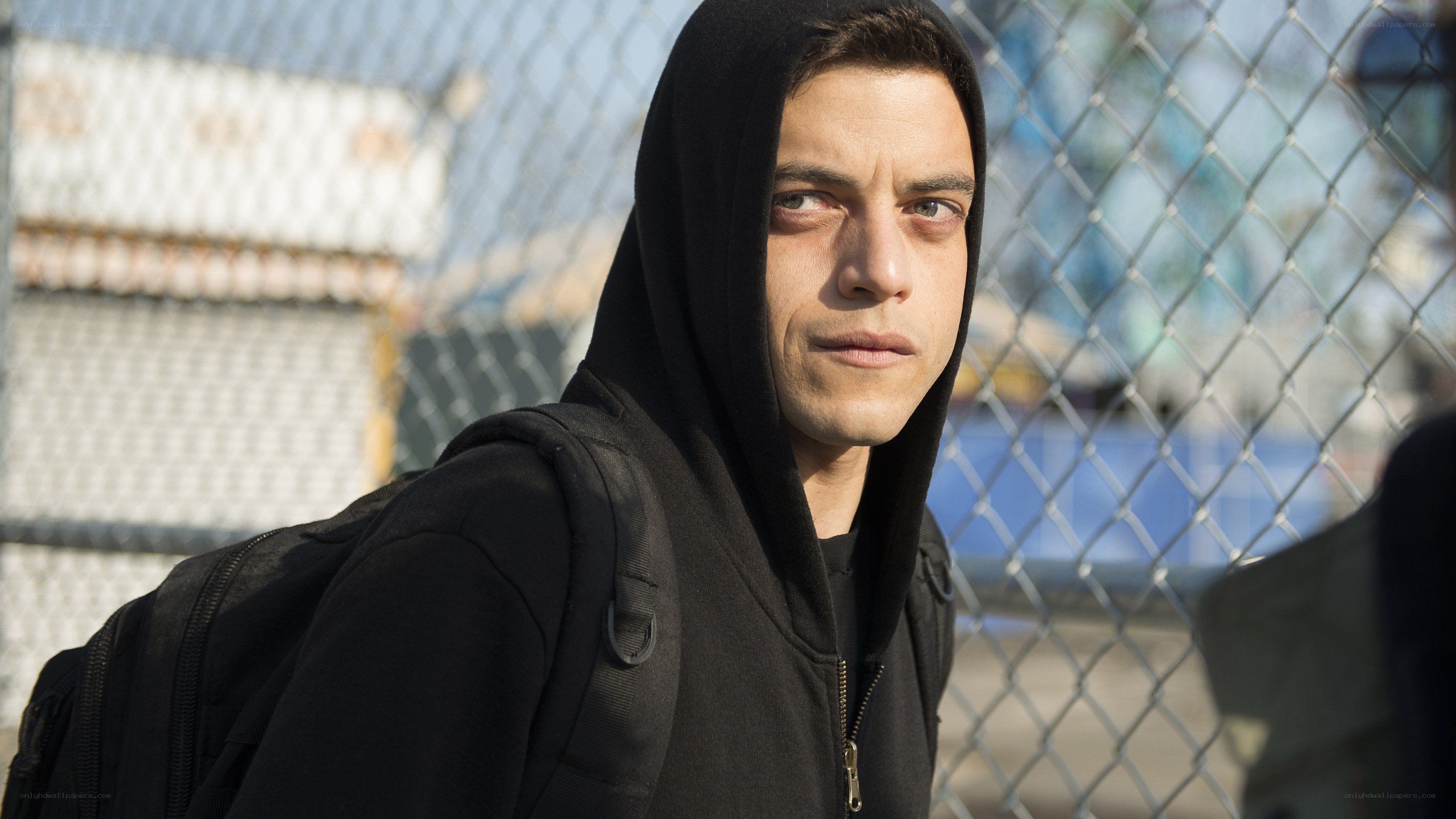 man in black hoodie with backpack