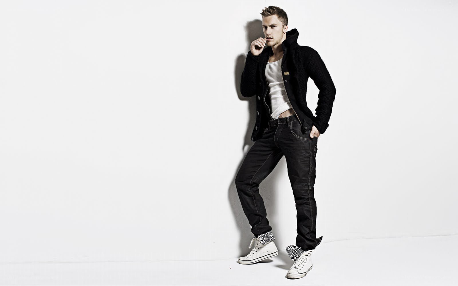 man in black jacket and jeans