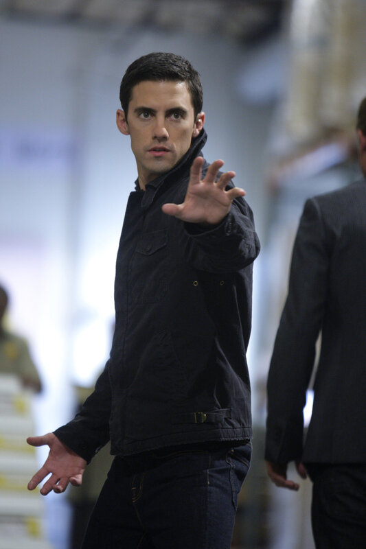 Man in black jacket gesturing