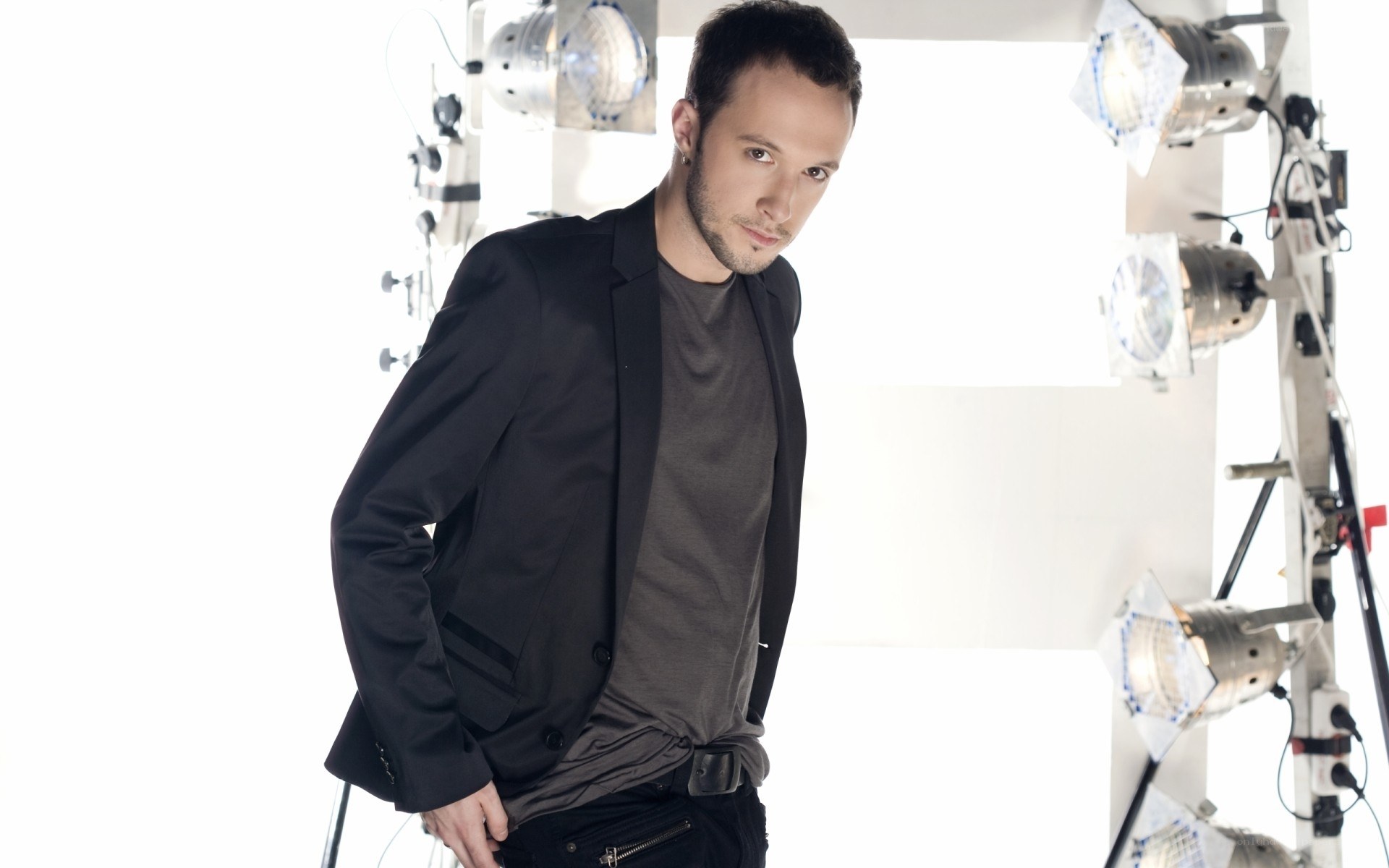 man in black jacket in studio