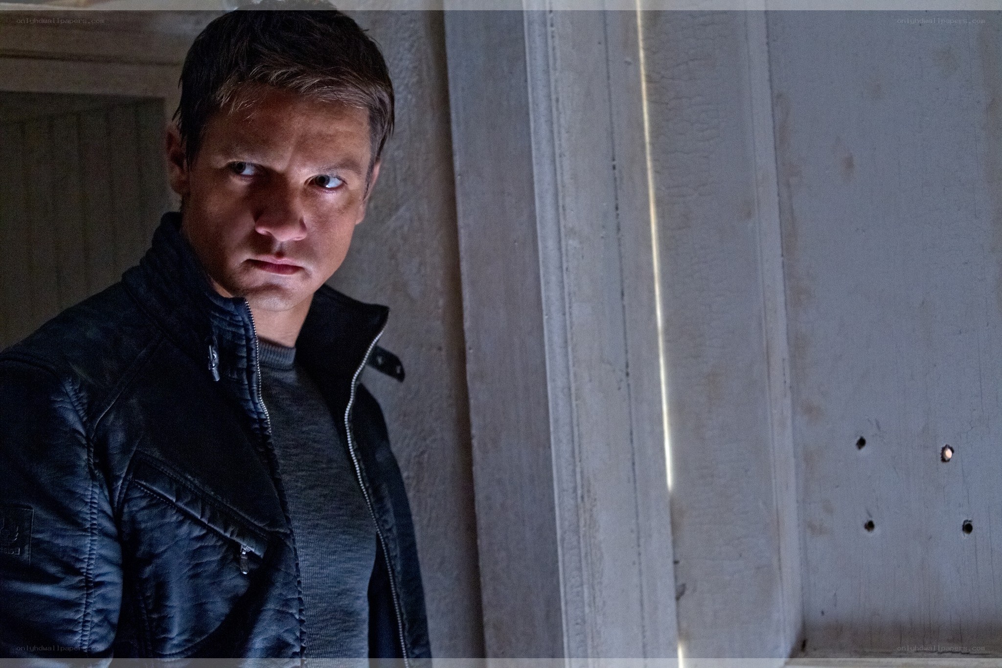 man in black jacket looking serious