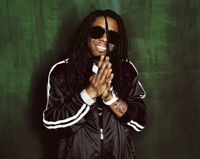 Man in black jacket with dreadlocks