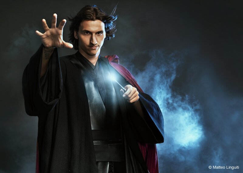 man in black robe casting spell