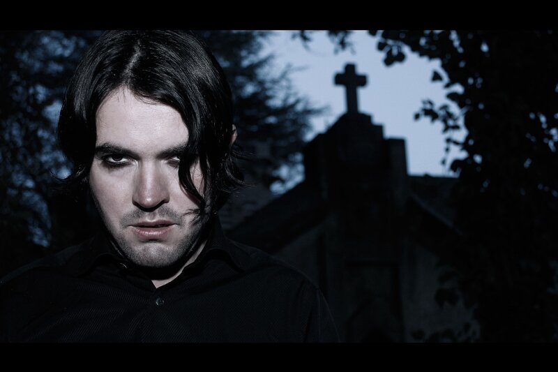 man in black shirt at cemetery