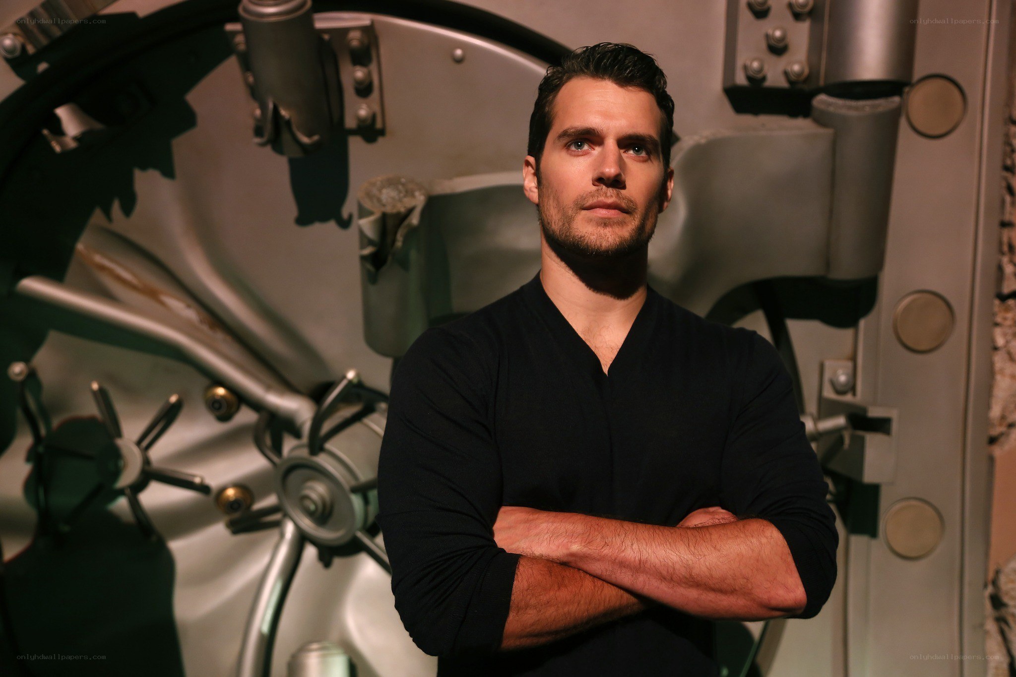 Man in black shirt in front of vault