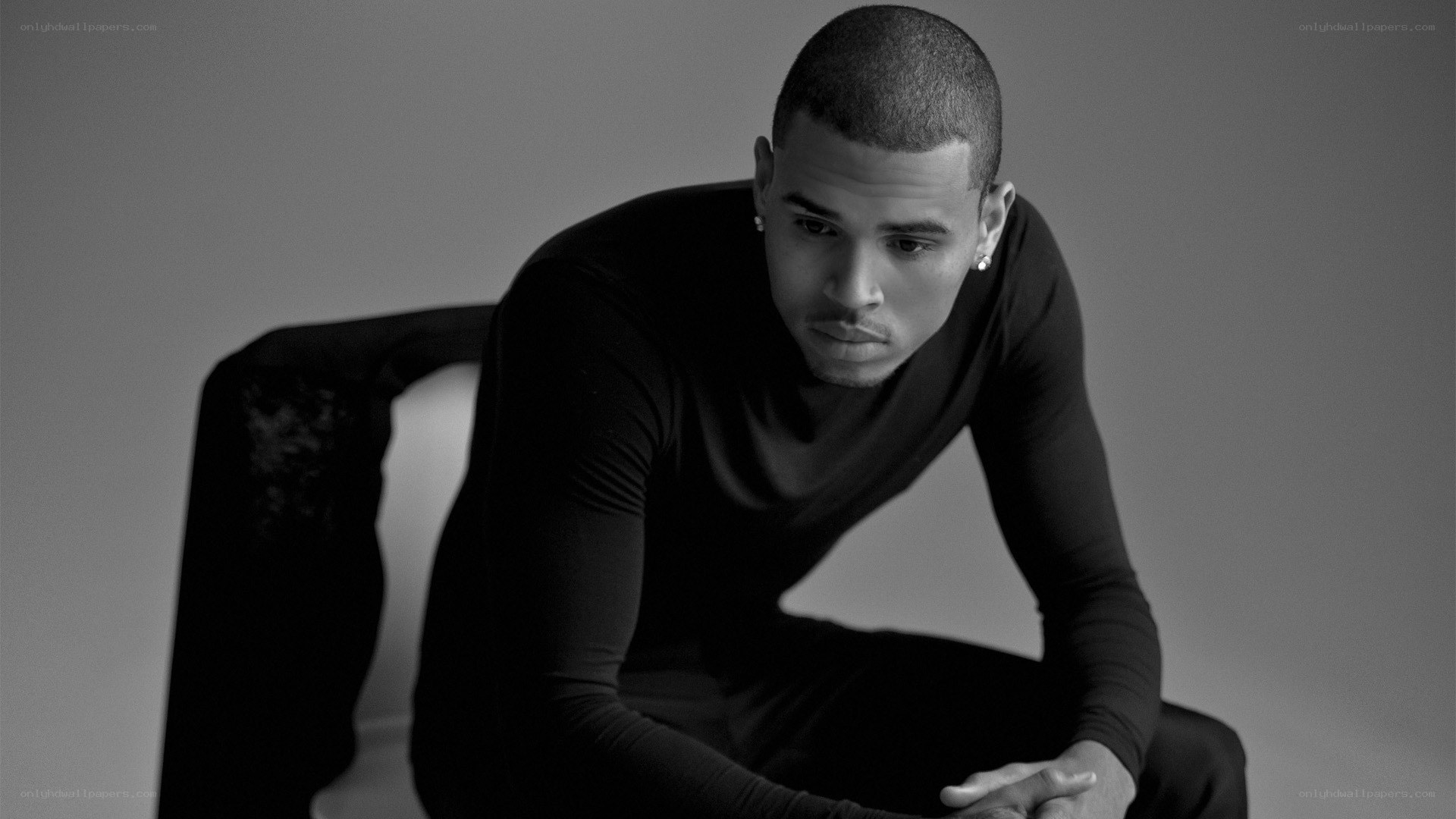 man in black shirt sitting