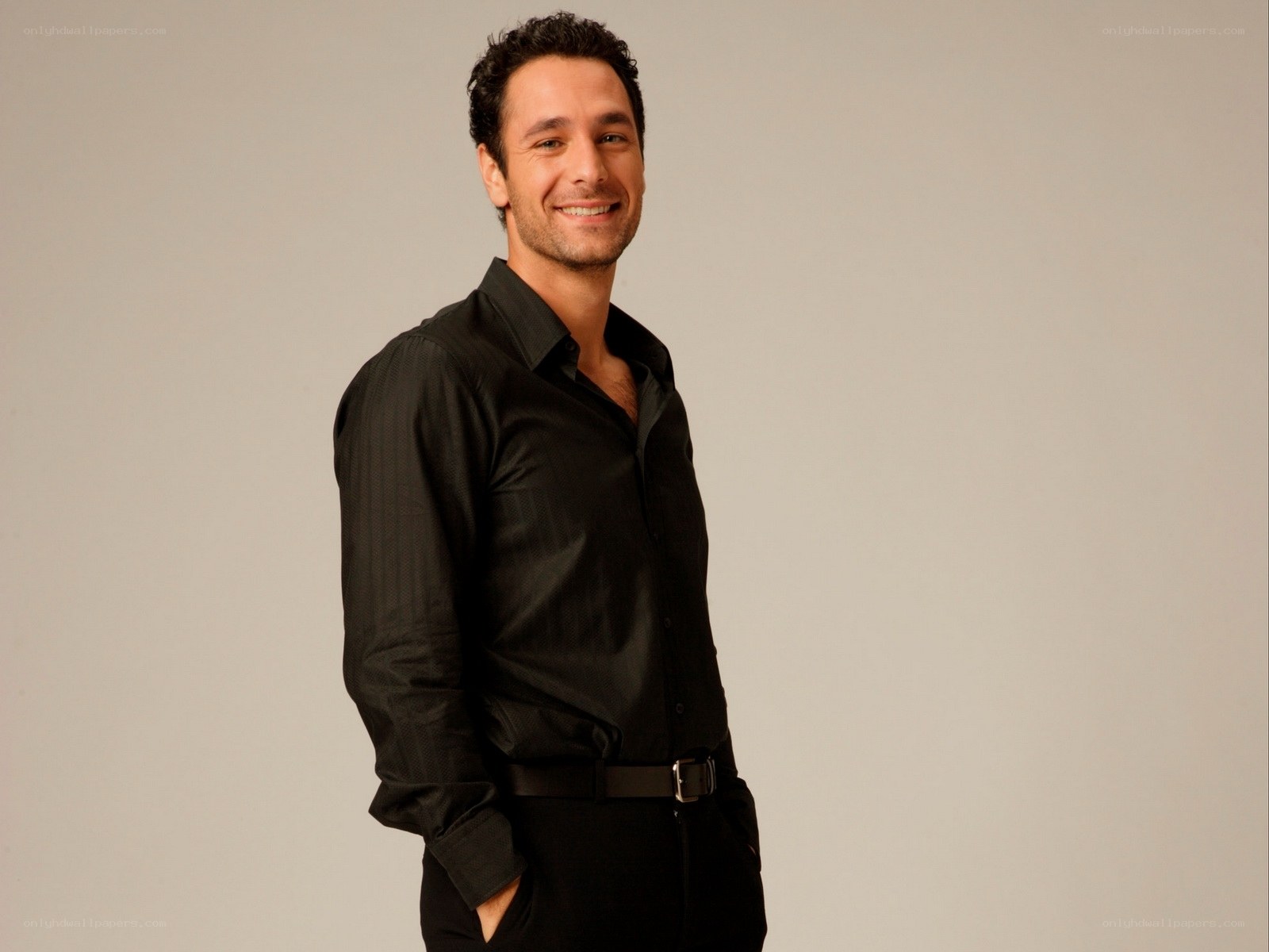 man in black shirt smiling