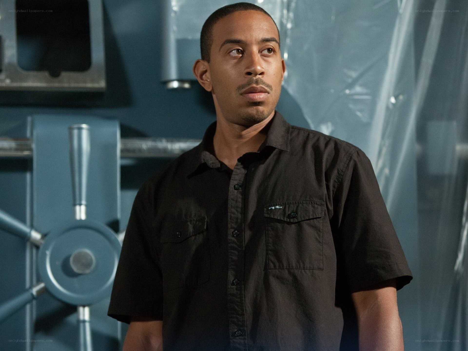 man in black shirt standing