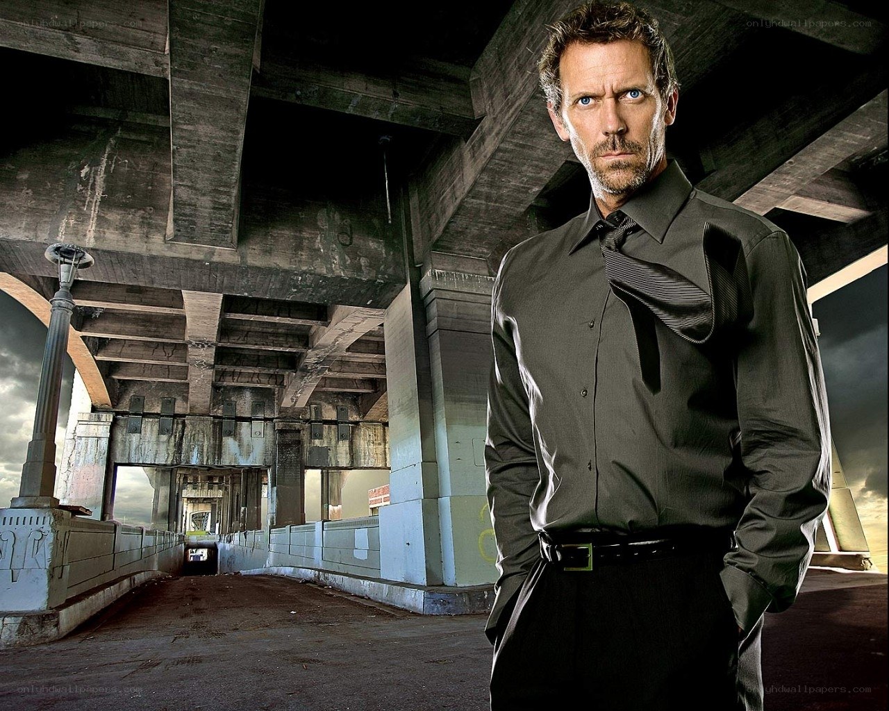 man in black shirt under bridge