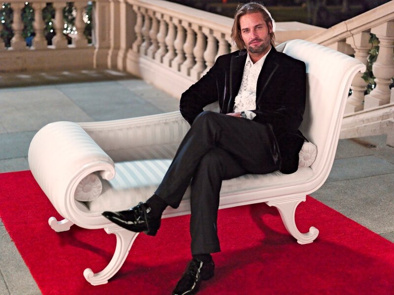 Man in Black Suit — Dramatic, Night, Photograph, White Chaise Lounge