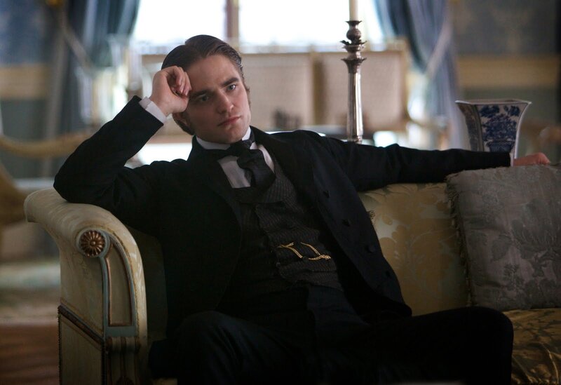 Man in Black Suit — Dramatic, Photograph, Couch