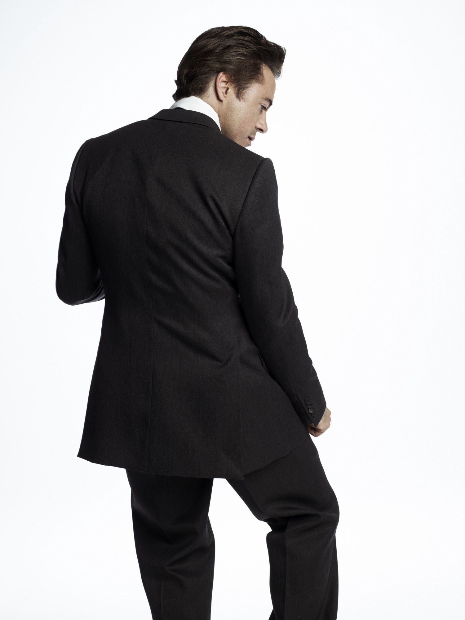 man in black suit from back