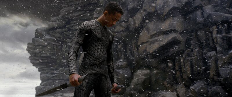 Man in Black Suit Holding Sword