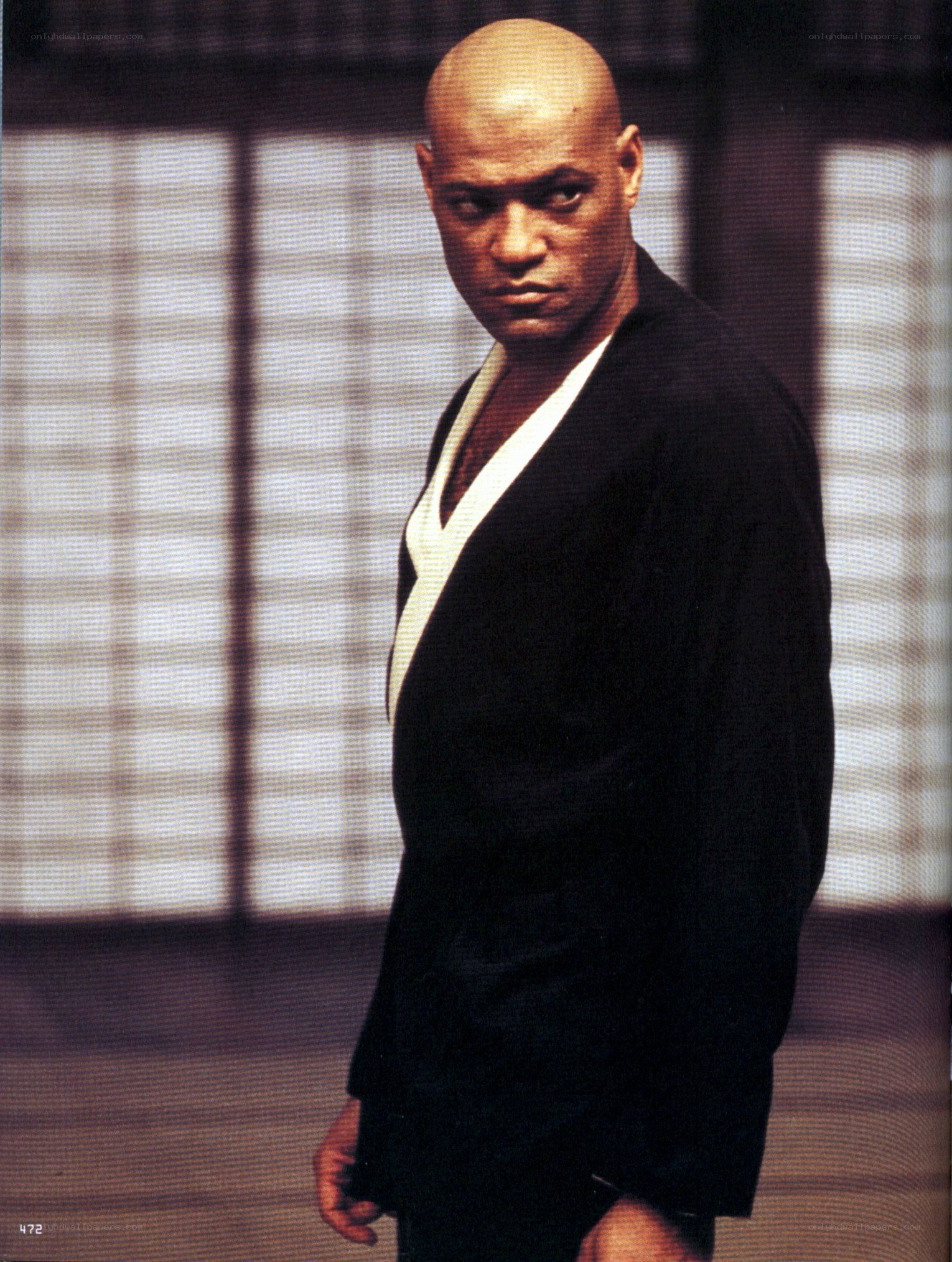man in black suit looking at camera