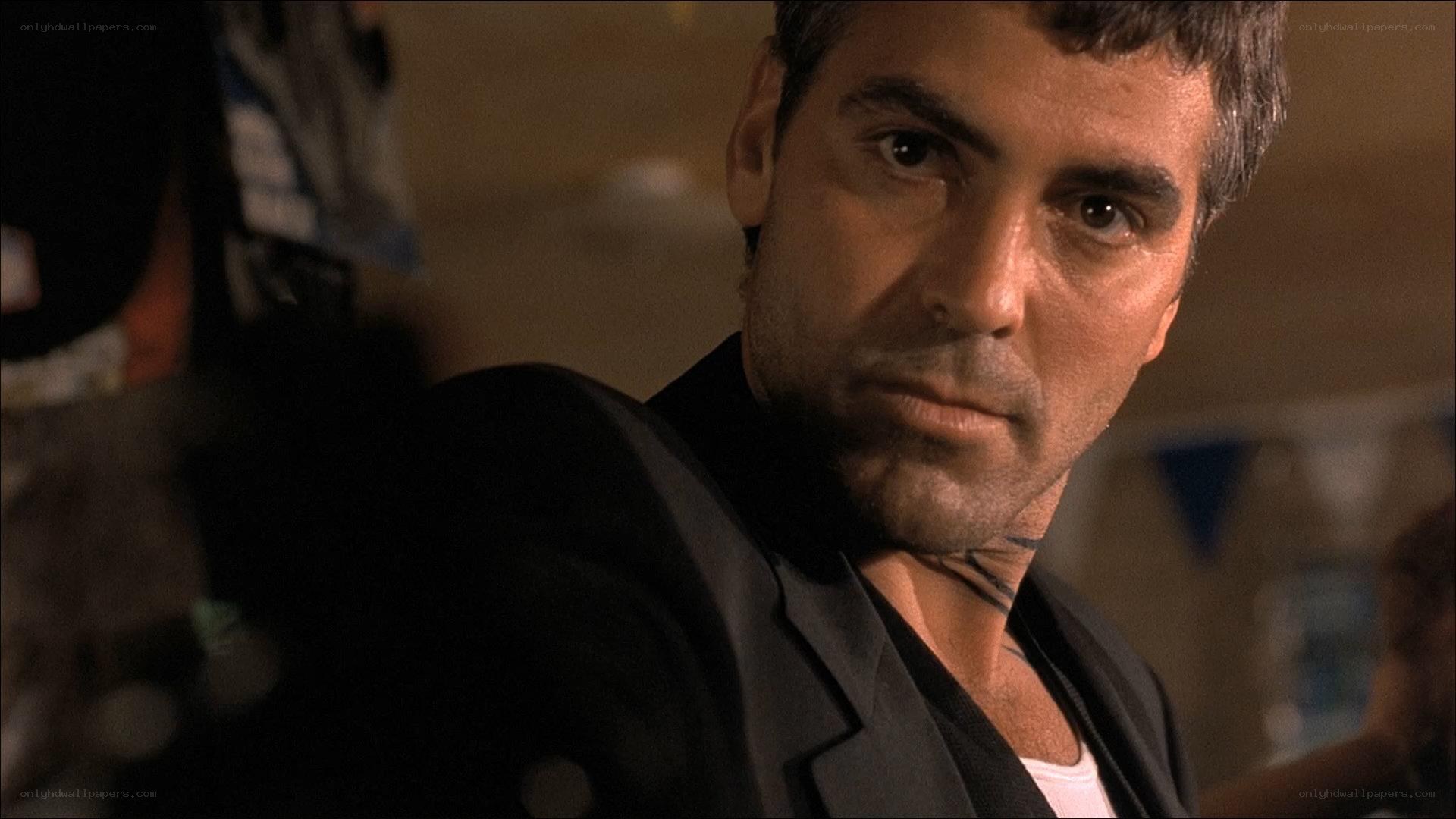 man in black suit looking