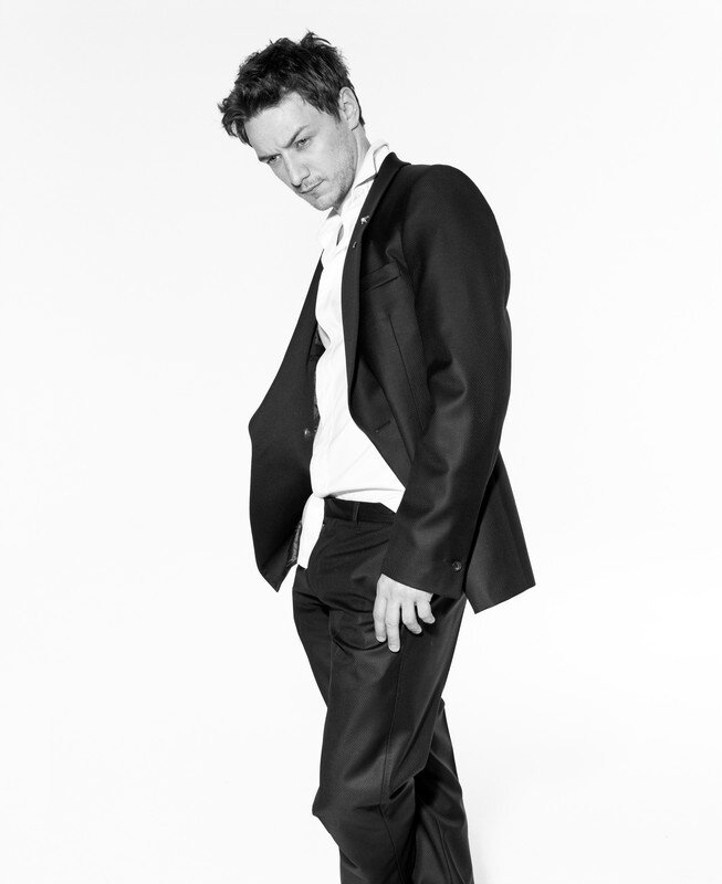 man in black suit posing