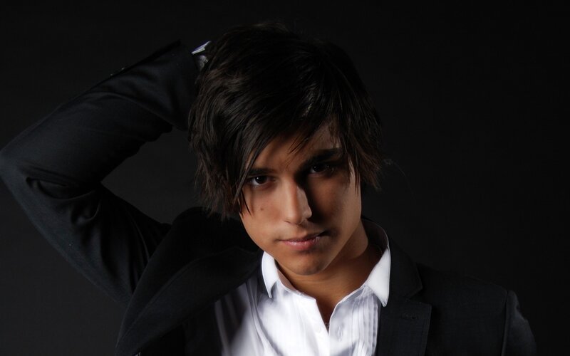 man in black suit posing