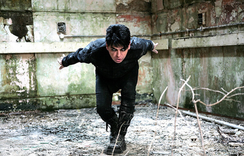 man in black suit running