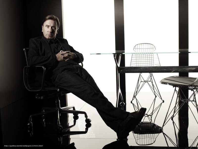 Man in black suit sitting