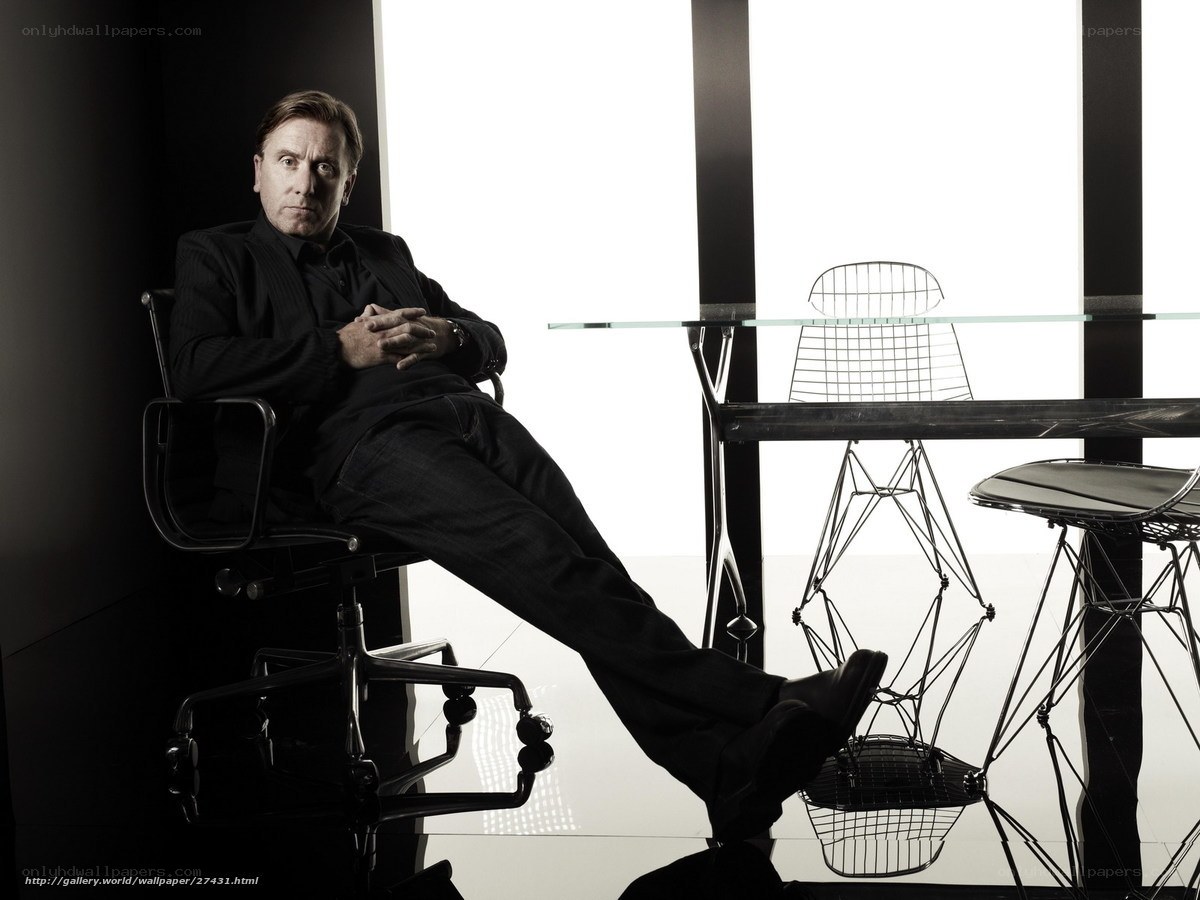 Man in black suit sitting