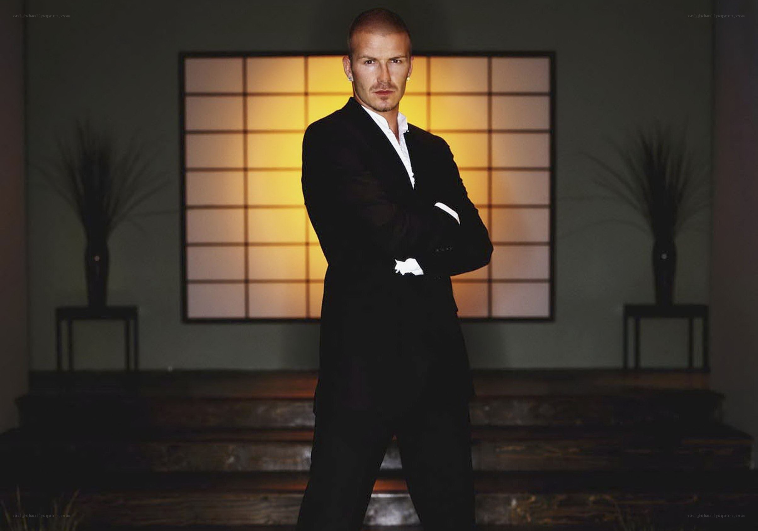 Man in black suit standing