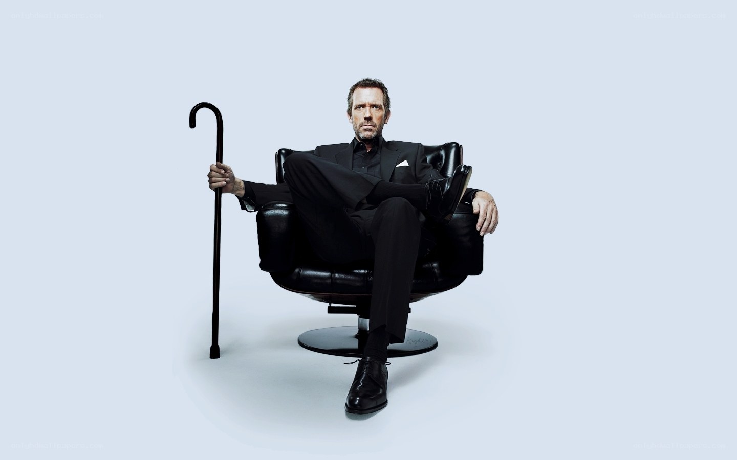 man in black suit with cane