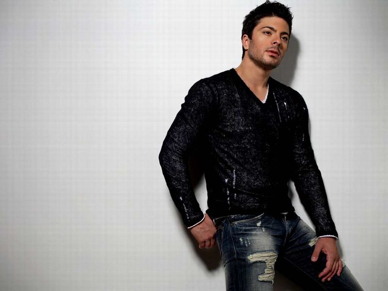 man in black sweater and jeans
