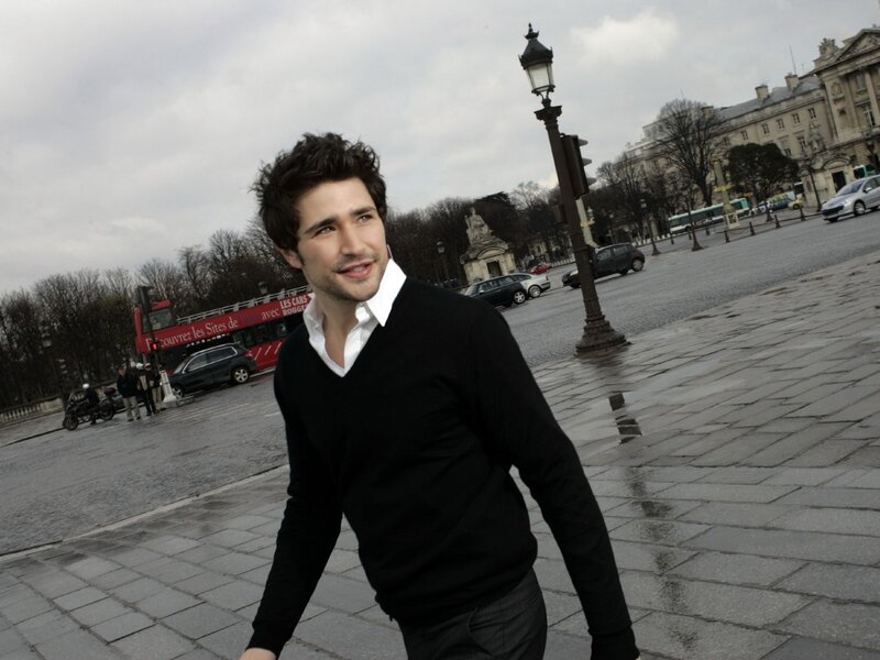 man in black sweater in paris