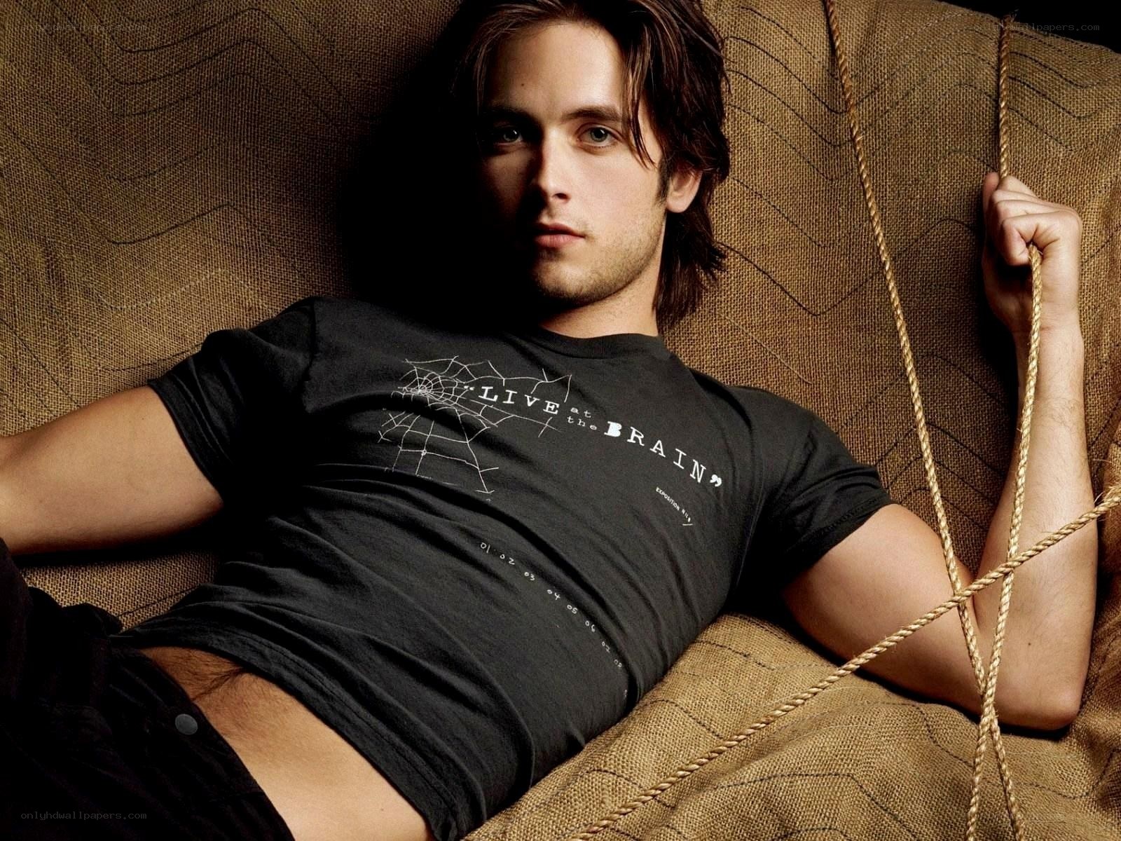 man in black t-shirt lying down
