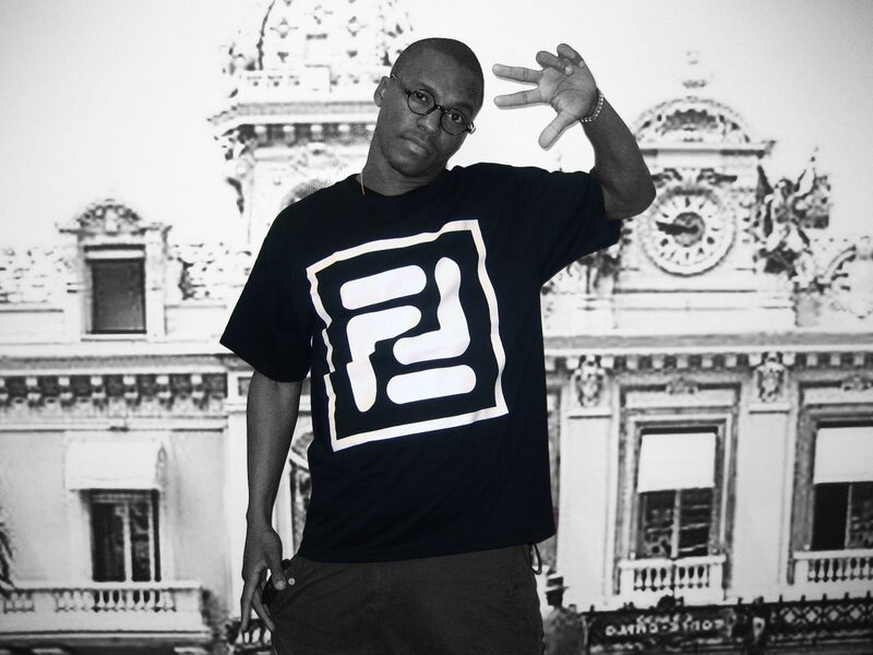 Man in black t-shirt with logo