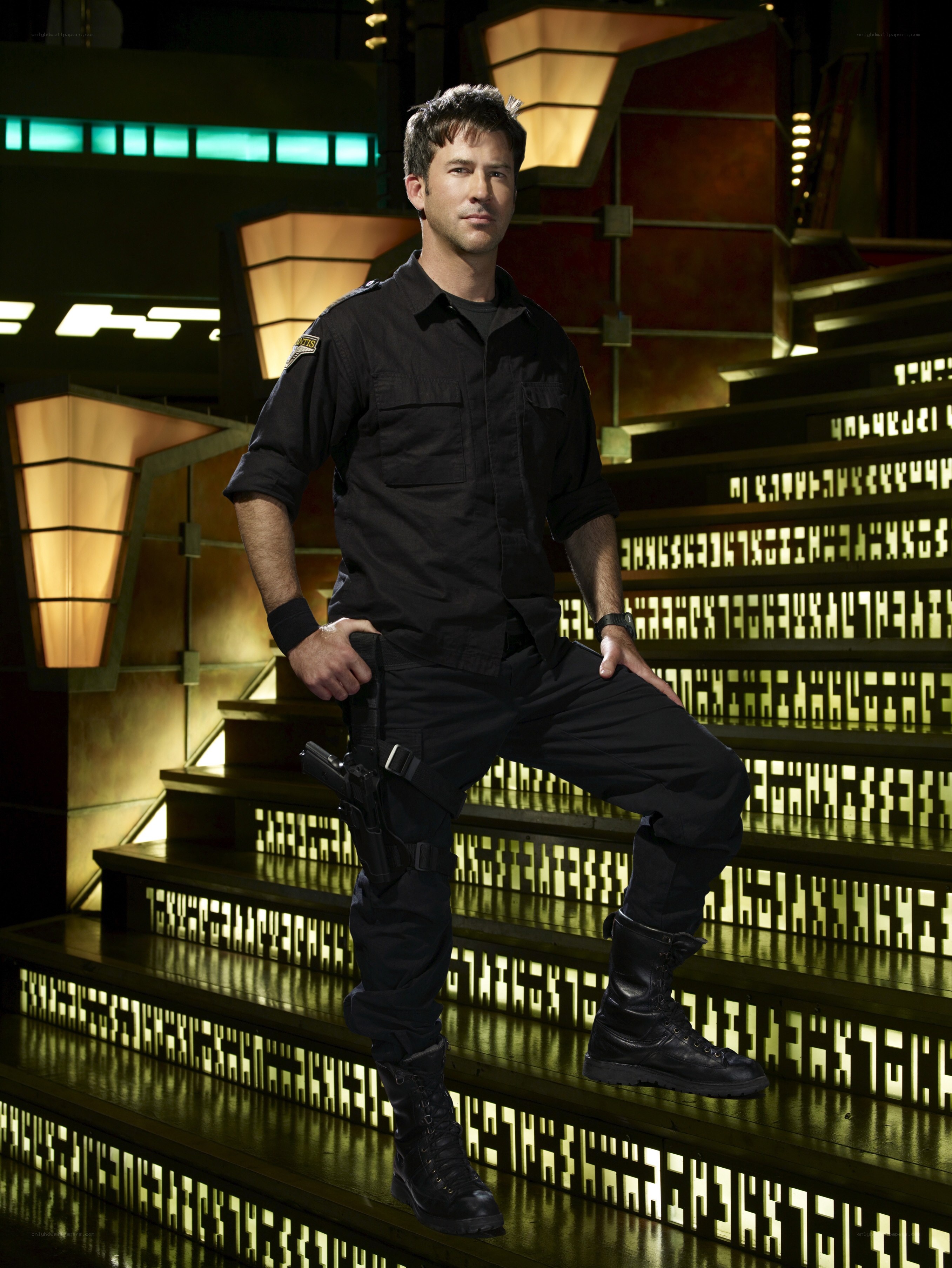 man in black uniform on stairs