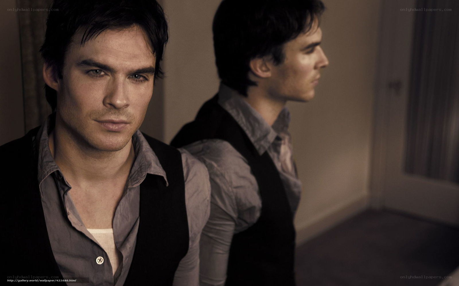 man in black vest