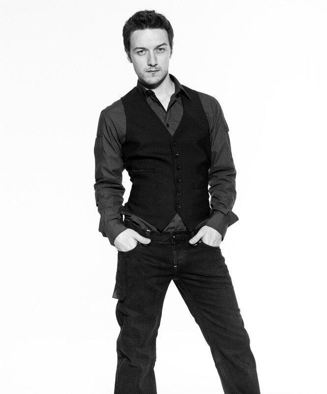 man in black vest and jeans