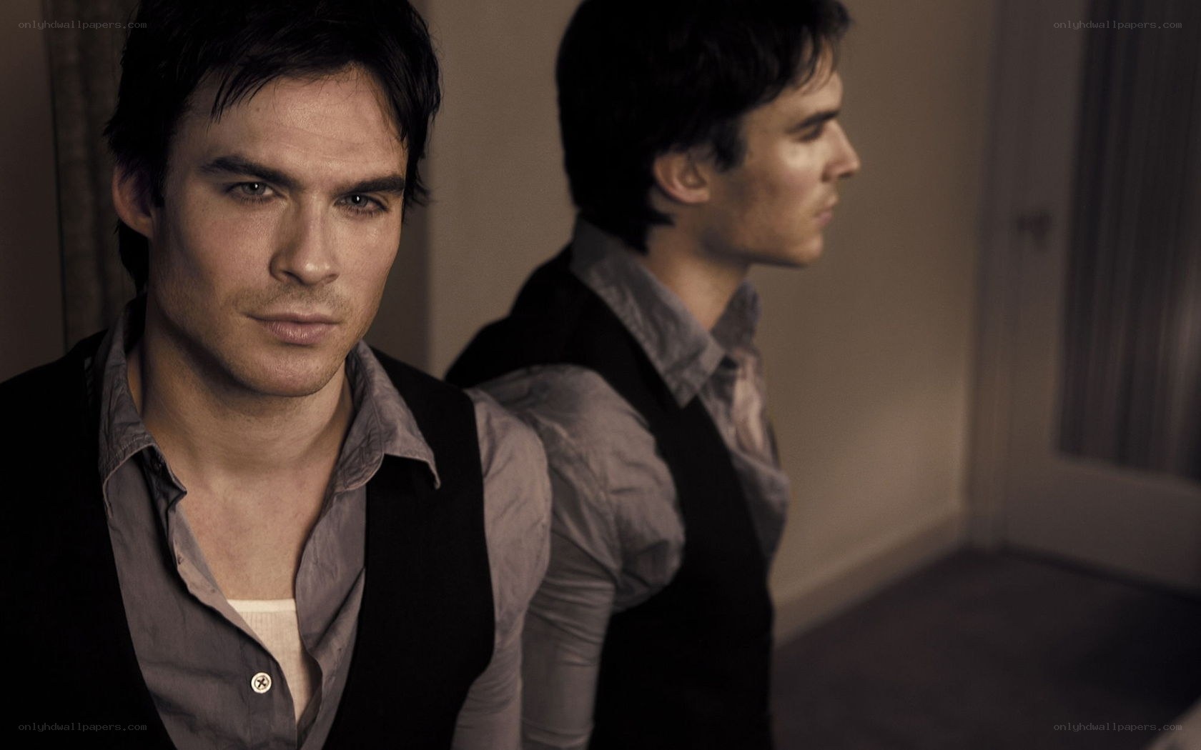man in black vest