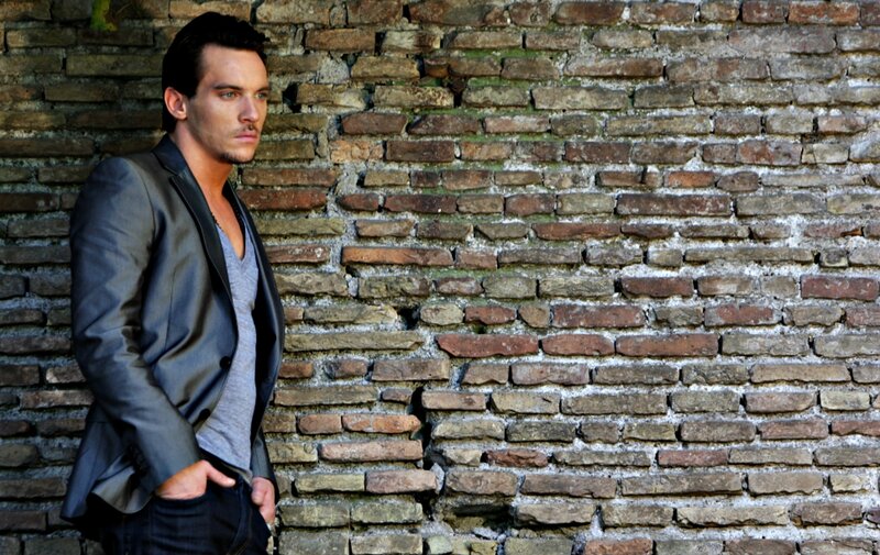 Man in Blazer Against Wall