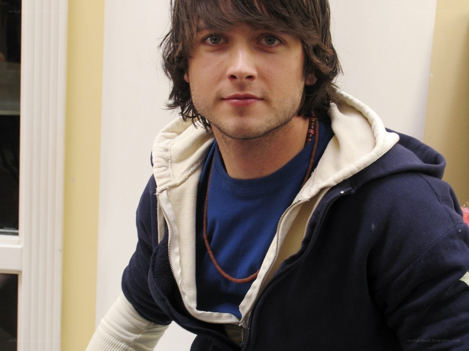 man in blue hoodie
