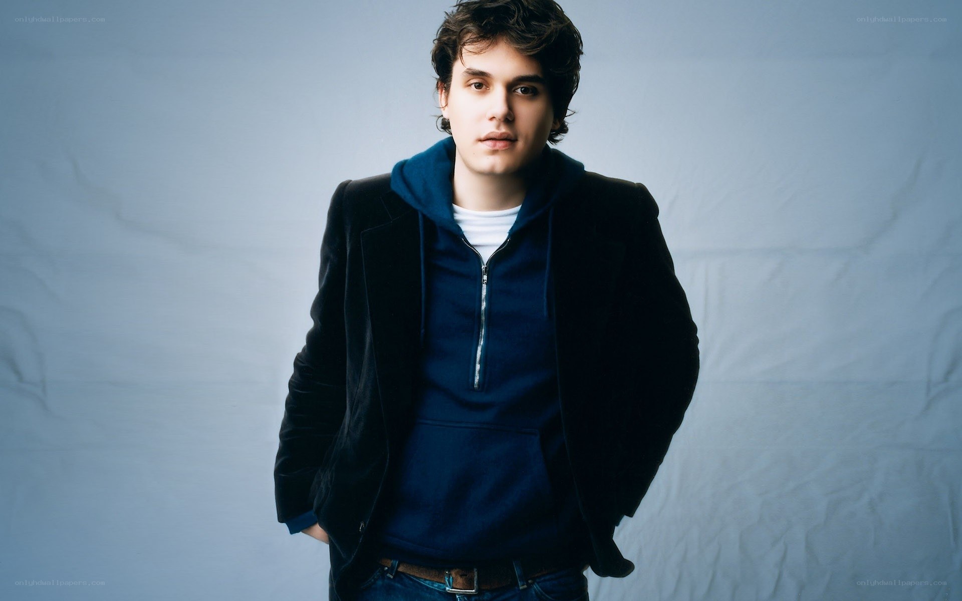 man in blue hoodie and jacket