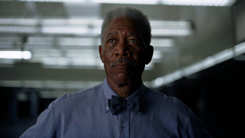 man in blue shirt and bow tie