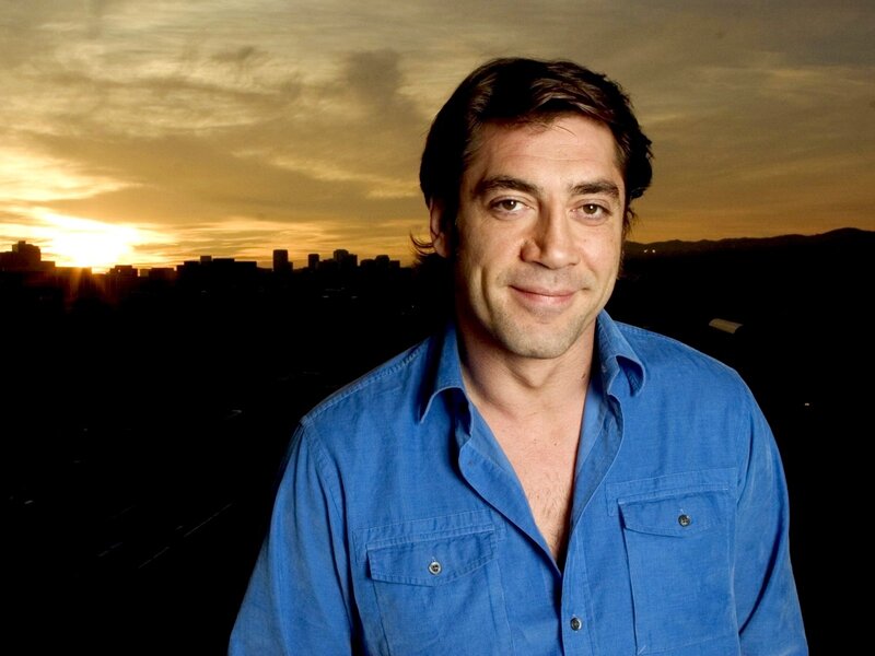 man in blue shirt at sunset