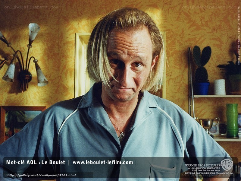 Man in blue shirt in room