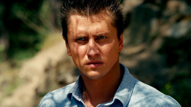 man in blue shirt outdoors