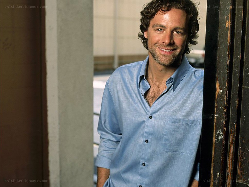 man in blue shirt smiling