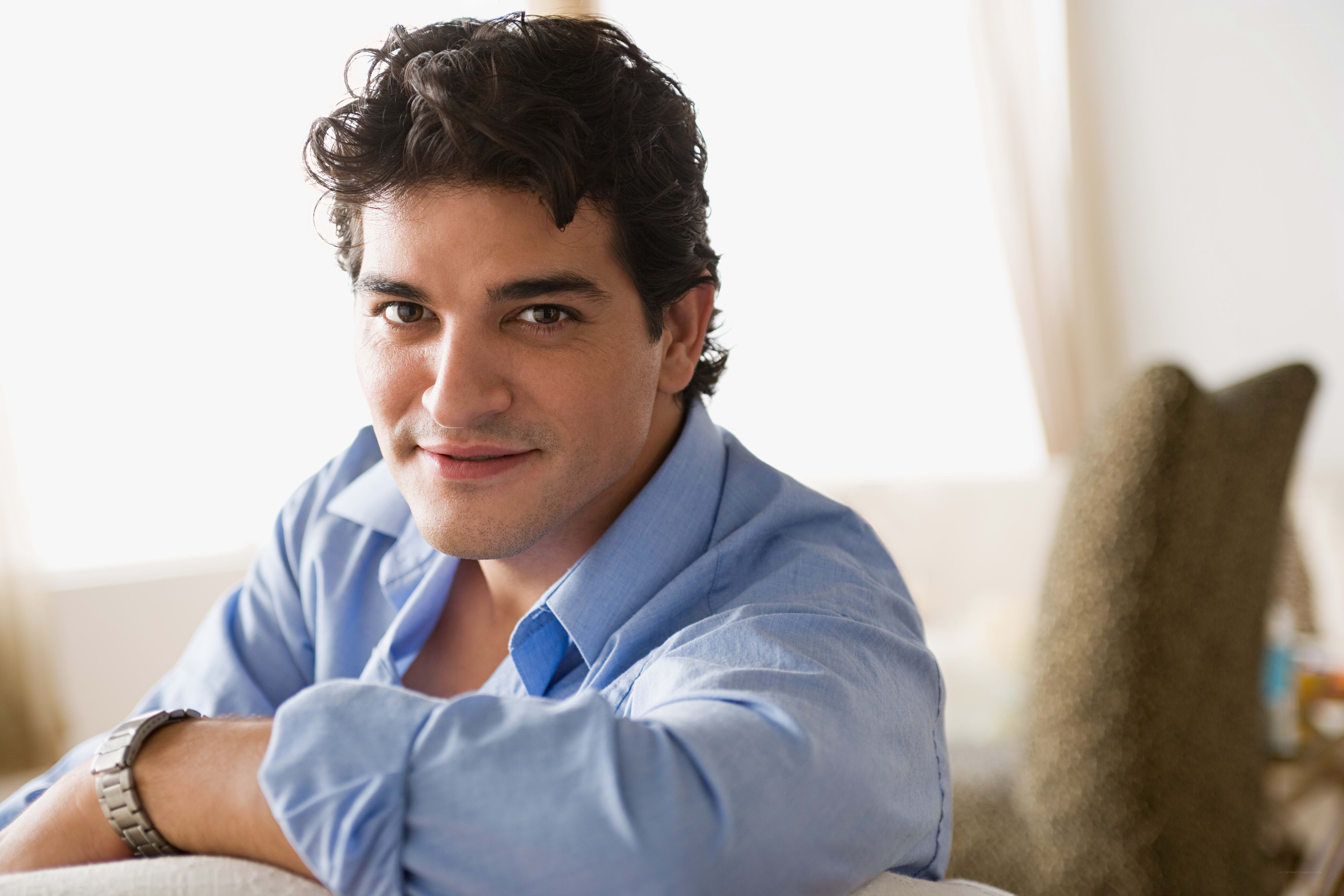man in blue shirt smiling