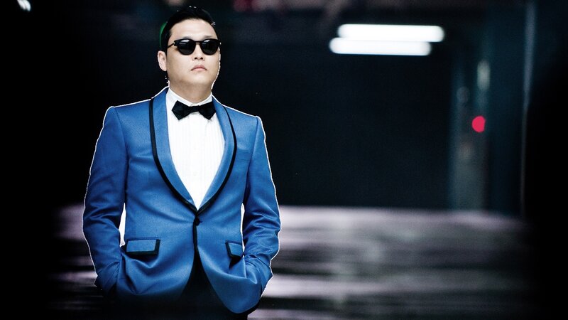 man in blue suit and sunglasses