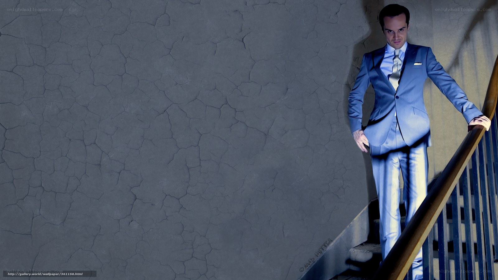 Man in blue suit on stairs