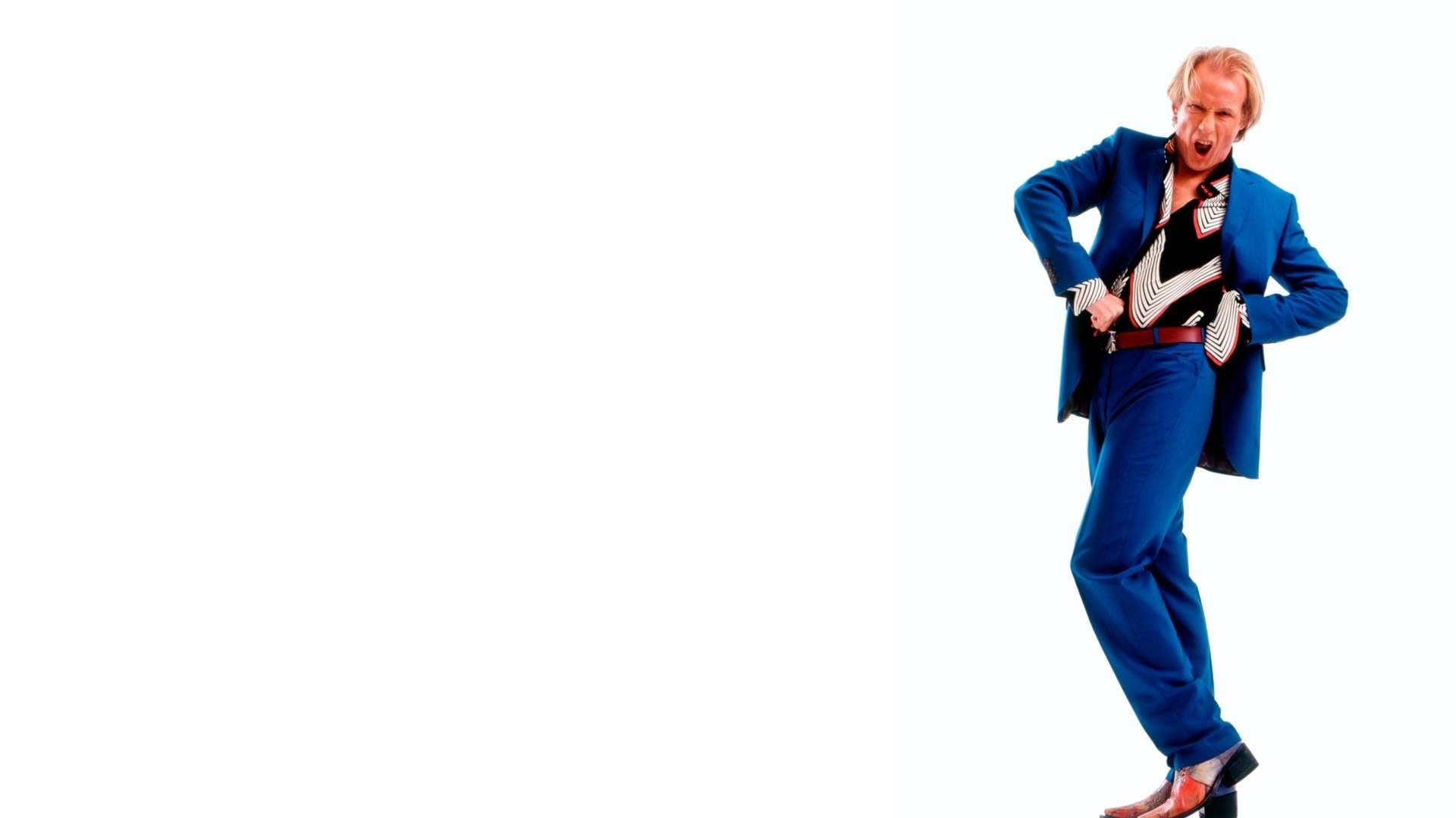Man in blue suit posing