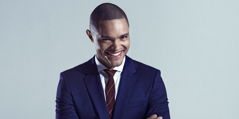 man in blue suit smiling