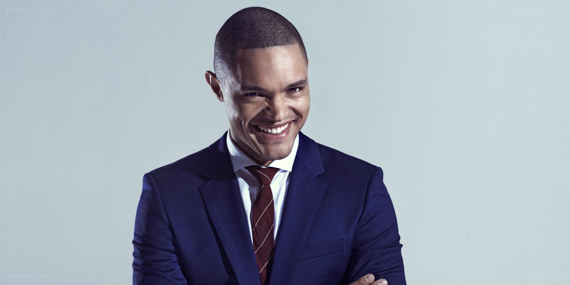 man in blue suit smiling