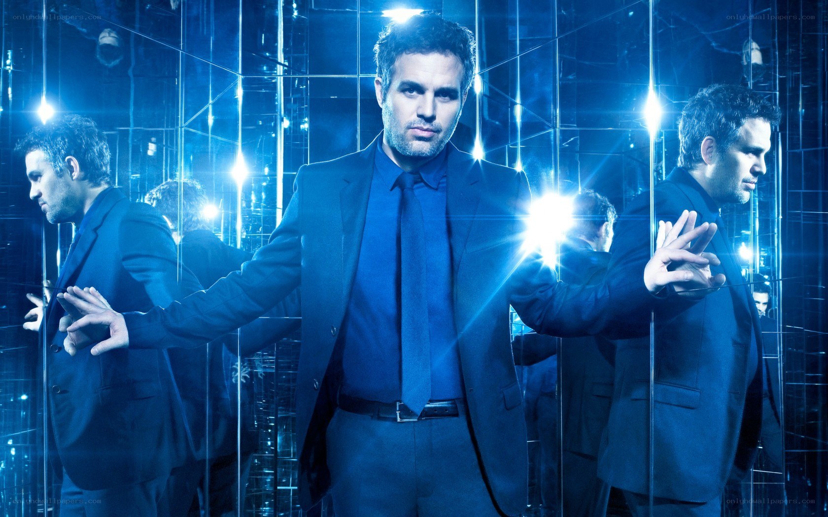 man in blue suit surrounded by mirrors