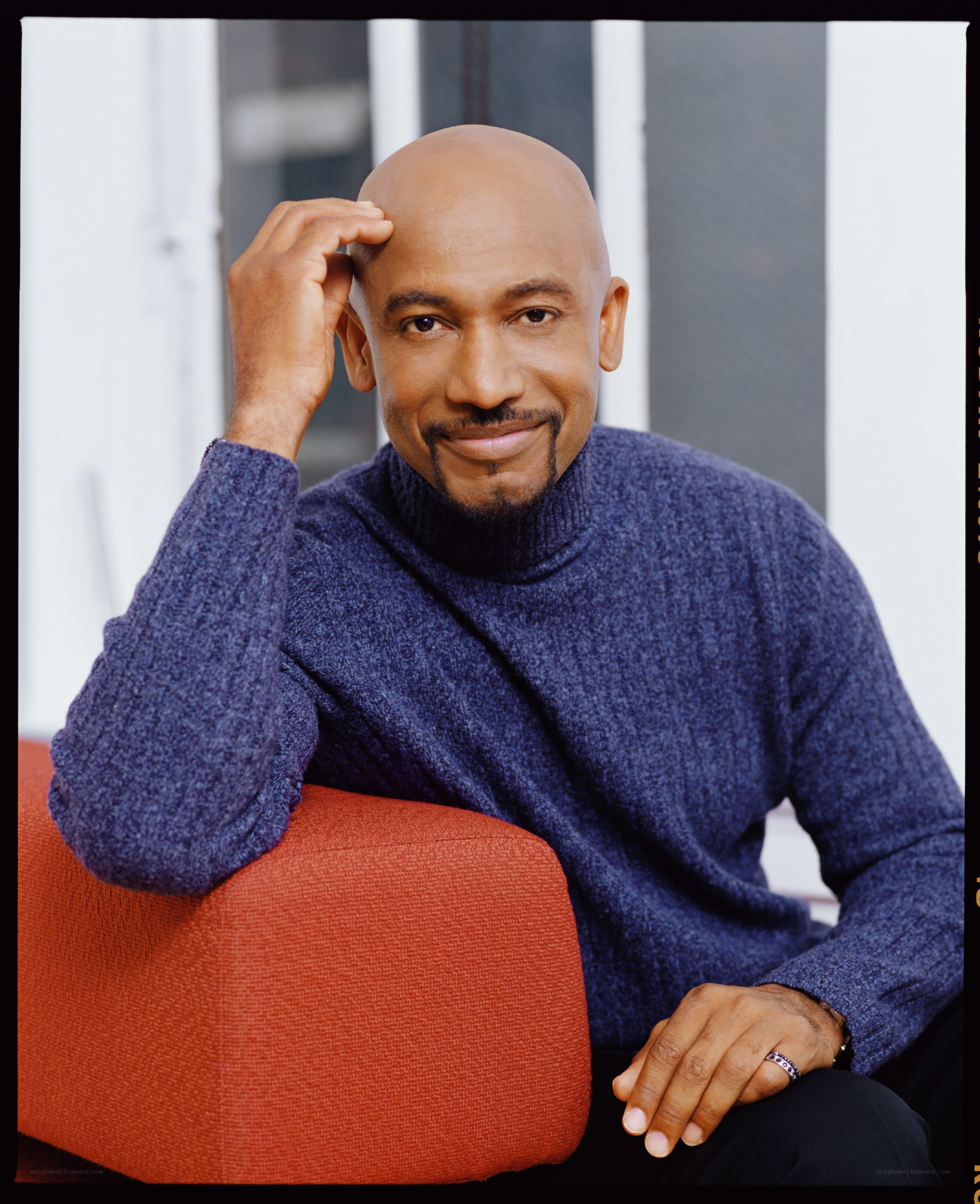 man in blue sweater sitting